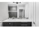 Modern bathroom features sleek vanity with sink, a large mirror and glass-enclosed shower offering style and functionality at 2435 S High St, Denver, CO 80210