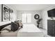 Bedroom showcasing modern design, a comfortable bed, and stylish decorative artwork for a relaxing atmosphere at 2435 S High St, Denver, CO 80210