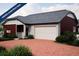 Charming single-story home with a two-car garage, covered porch, and low-maintenance landscaping at 21817 E 51St Dr, Aurora, CO 80019