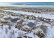 Aerial winter view showing house and surrounding neighborhood at 23480 E Moraine Pl, Aurora, CO 80016