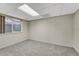 Finished basement room with carpet and window at 23480 E Moraine Pl, Aurora, CO 80016