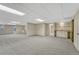 Finished basement recreation room with wet bar and built-in shelving at 23480 E Moraine Pl, Aurora, CO 80016