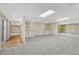 Spacious basement recreation room with wet bar and built-in shelving at 23480 E Moraine Pl, Aurora, CO 80016