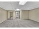 Finished basement recreation room with mirrored closet and carpet at 23480 E Moraine Pl, Aurora, CO 80016