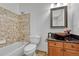 Bathroom with tub, toilet, and updated vanity at 23480 E Moraine Pl, Aurora, CO 80016