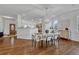 Open dining area with hardwood floors and modern chandelier at 23480 E Moraine Pl, Aurora, CO 80016