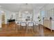 Bright dining room with hardwood floors and a spacious table, ready for gatherings at 23480 E Moraine Pl, Aurora, CO 80016