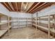 Unfinished basement area with wood shelving at 23480 E Moraine Pl, Aurora, CO 80016