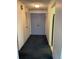 View of the hallway leading to the apartment with double doors at 3131 E Alameda Ave # 604, Denver, CO 80209