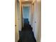 View of a hallway with multiple closet doors at 3131 E Alameda Ave # 604, Denver, CO 80209