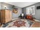 Cozy bedroom with wood cabinet and area rug at 401 S Dover Ct, Lakewood, CO 80226