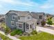 An aerial view of a two-story home with a well-kept lawn, tidy landscaping, and a two-car garage at 12940 Brier Ct, Firestone, CO 80504