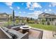 Beautiful backyard space complete with patio seating, lush landscaping, and plenty of room for outdoor enjoyment at 12940 Brier Ct, Firestone, CO 80504