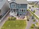 An aerial view of a beautiful backyard with a lawn and outdoor seating area at 12940 Brier Ct, Firestone, CO 80504