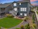 A spacious backyard with a patio, outdoor seating, a lush lawn, and thoughtful landscaping at 12940 Brier Ct, Firestone, CO 80504