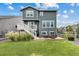 A cozy backyard with a lawn, patio, and outdoor seating at 12940 Brier Ct, Firestone, CO 80504
