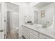 A bright and well-lit bathroom with double sinks and modern fixtures at 12940 Brier Ct, Firestone, CO 80504
