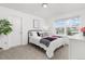 Cozy bedroom featuring a plush bed and window for natural light at 12940 Brier Ct, Firestone, CO 80504