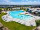 Aerial view of resort-style pool with lap lanes and splash pad and lounge chairs at 12940 Brier Ct, Firestone, CO 80504