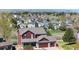 Aerial view of a two-story home in a suburban neighborhood with mountain views at 20670 Bridlewood Ln, Parker, CO 80138
