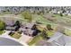 Aerial view of a two-story home with a well-manicured lawn and a three-car garage at 20670 Bridlewood Ln, Parker, CO 80138