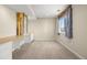 Basement bonus room featuring custom built-ins and a sunny window with wood trim at 20670 Bridlewood Ln, Parker, CO 80138