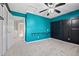 Bedroom with gray carpet, blue walls, and desk at 20670 Bridlewood Ln, Parker, CO 80138
