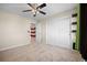 Bedroom with gray carpet, closet, and fan at 20670 Bridlewood Ln, Parker, CO 80138