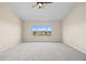 Bedroom with neutral carpet, a ceiling fan, and a large window with a view at 20670 Bridlewood Ln, Parker, CO 80138