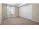 Neutral bedroom with plush carpeting, closet, and window with white blinds at 20670 Bridlewood Ln, Parker, CO 80138