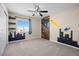 Bedroom with gray carpet, fan, and wall decals at 20670 Bridlewood Ln, Parker, CO 80138