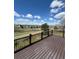 Spacious deck overlooking a lush greenbelt with walking trail offering serene views and privacy at 20670 Bridlewood Ln, Parker, CO 80138