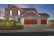 Charming two-story home featuring a three-car garage and well-maintained landscaping at dusk at 20670 Bridlewood Ln, Parker, CO 80138