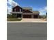 Charming two-story home with a three car garage, well-maintained lawn, and manicured landscaping at 20670 Bridlewood Ln, Parker, CO 80138