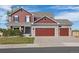 Charming two-story home featuring a three-car garage and well-maintained landscaping at 20670 Bridlewood Ln, Parker, CO 80138