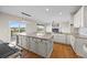 Open concept kitchen with granite countertops, island with seating, and stainless steel appliances at 20670 Bridlewood Ln, Parker, CO 80138