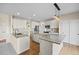 Expansive kitchen features granite counters, custom cabinetry, and stainless steel appliances at 20670 Bridlewood Ln, Parker, CO 80138