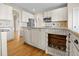 Custom kitchen with built-in pet feeding station, granite countertops, and stainless steel appliances at 20670 Bridlewood Ln, Parker, CO 80138