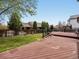 Expansive wooden deck overlooking the backyard, providing a serene outdoor living space at 5204 S Parfet Way, Littleton, CO 80127