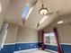 Bedroom featuring high vaulted ceilings with a skylight at 5204 S Parfet Way, Littleton, CO 80127