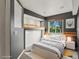 Bedroom with lofted shelf, gray accent wall and carpet floors at 5204 S Parfet Way, Littleton, CO 80127