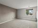 Bedroom featuring a window and neutral paint at 5204 S Parfet Way, Littleton, CO 80127