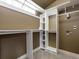 Spacious walk-in closet with custom shelving and hanging rods at 5204 S Parfet Way, Littleton, CO 80127