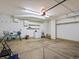 Clean and organized two car garage with lighting, shelving and workbench at 5204 S Parfet Way, Littleton, CO 80127