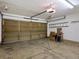 Spacious garage with ample storage space, perfect for parking vehicles and organizing tools at 5204 S Parfet Way, Littleton, CO 80127