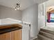 Upstairs hallway landing featuring light fixtures and stairwell at 5204 S Parfet Way, Littleton, CO 80127