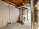 Basement laundry area featuring a washer, dryer, exposed ductwork and utility access at 5204 S Parfet Way, Littleton, CO 80127