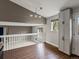 Upstairs loft area featuring hardwood floors, natural light, and view from the window at 5204 S Parfet Way, Littleton, CO 80127