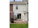 Back patio with sliding glass door, table, chairs, BBQ and a satellite dish at 9632 W Cornell Pl, Lakewood, CO 80227