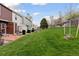 View of a green backyard with grass and a wooden fence, perfect for outdoor enjoyment at 9632 W Cornell Pl, Lakewood, CO 80227